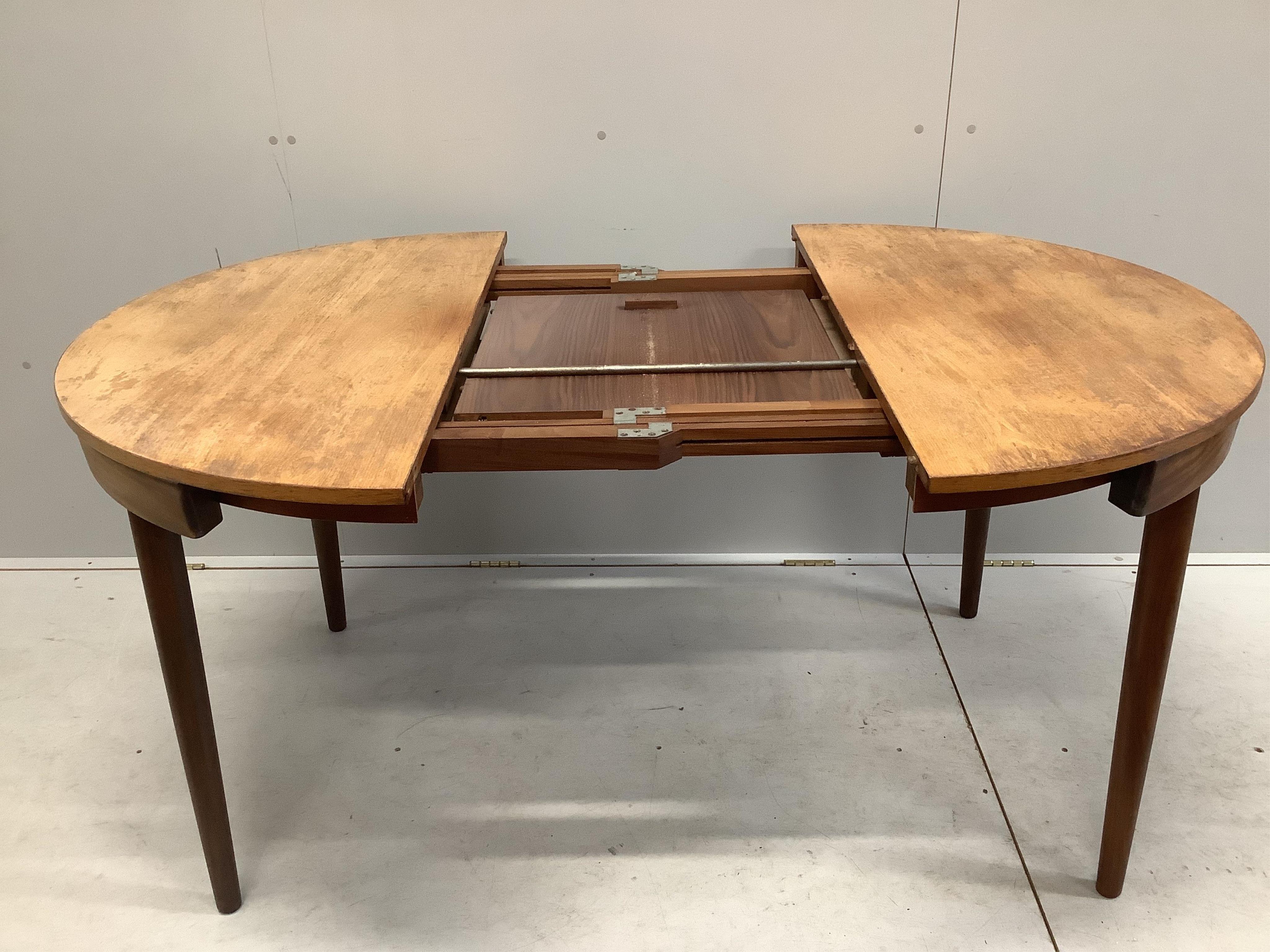 Hans Olsen for Frem Rojle, a mid century Danish teak 'Roundette' dining table, 156cm extended, depth 106cm, height 74cm together with four chairs. Condition - fair, top severely sun faded